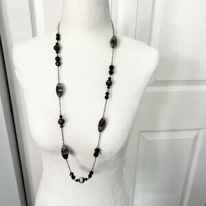 Black long beaded elegant fancy station necklace on silver tone chain